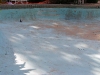 Daydream Island Resort with pool showing worn and faded coating.